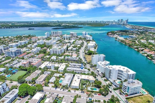 drone / aerial view featuring a water view and a city view