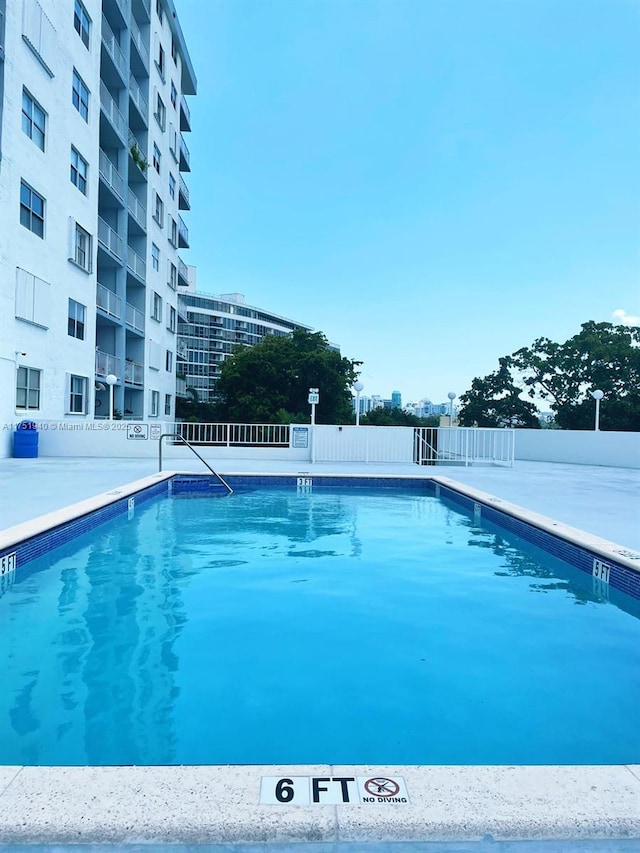 community pool with fence