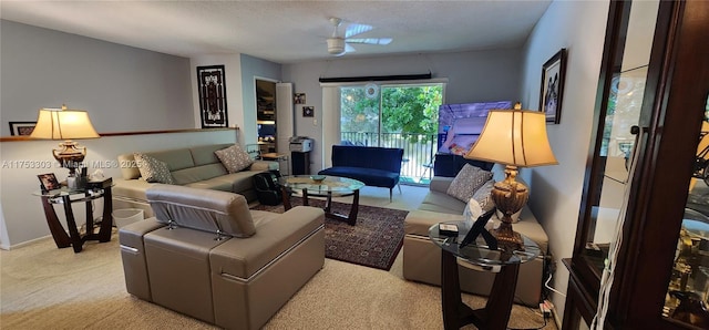 carpeted living area featuring a textured ceiling