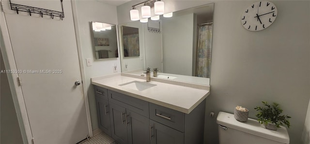 bathroom featuring vanity and toilet