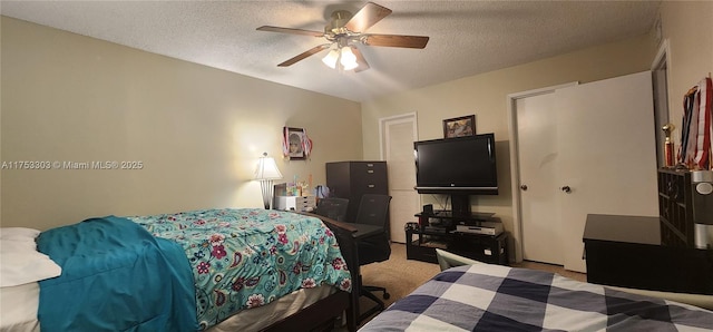 111 Gardens Dr Unit 203, Pompano Beach, FL 33069 - bedroom featuring carpet flooring, a textured ceiling, ceiling fan, and a closet