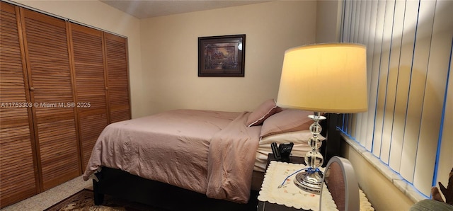 bedroom with carpet floors and a closet