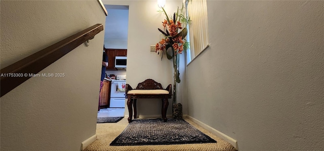 111 Gardens Dr Unit 203, Pompano Beach, FL 33069 - staircase with a textured wall and carpet