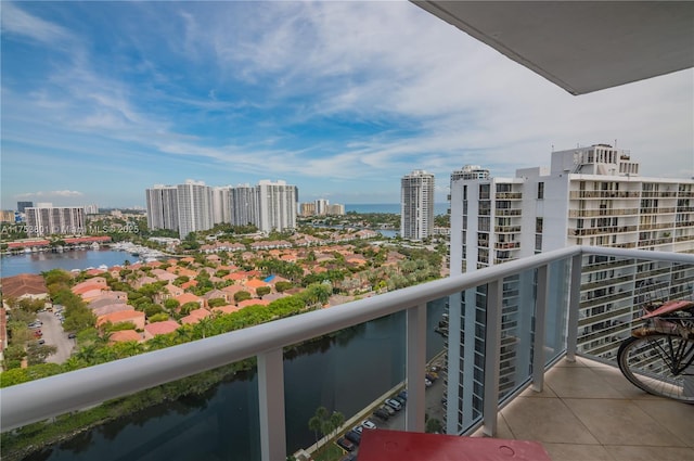 balcony featuring a water view and a view of city