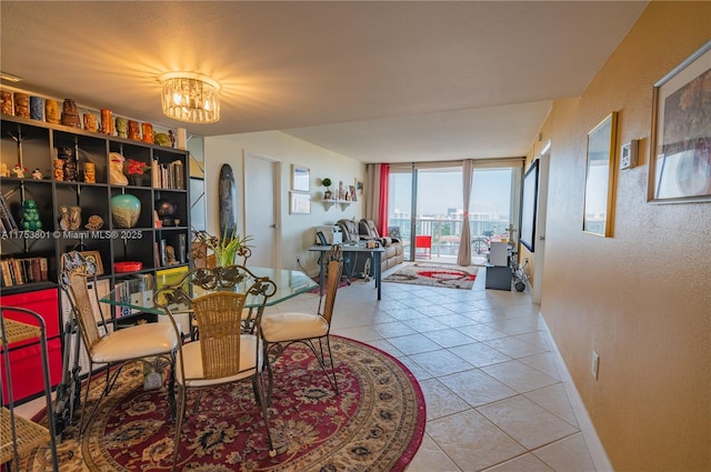 dining area with expansive windows, light tile patterned flooring, and an inviting chandelier