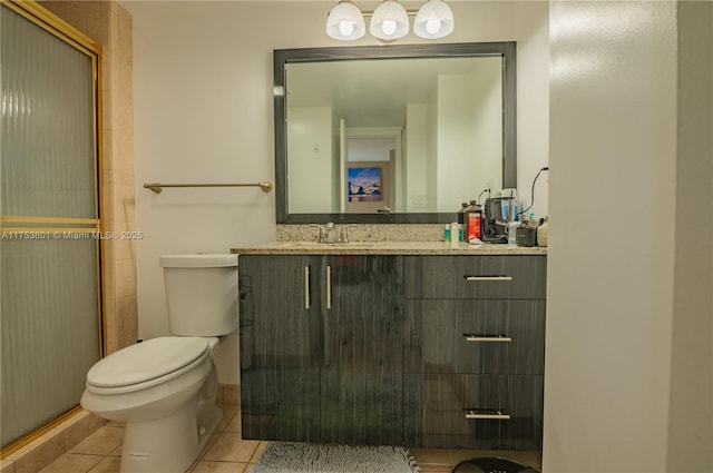 full bath featuring toilet, tile patterned flooring, an enclosed shower, and vanity