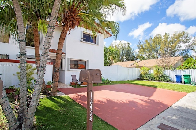 exterior space with a fenced backyard and a yard