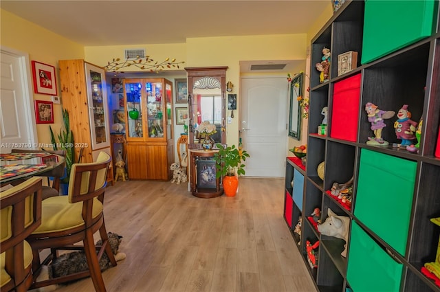 interior space featuring visible vents and wood finished floors