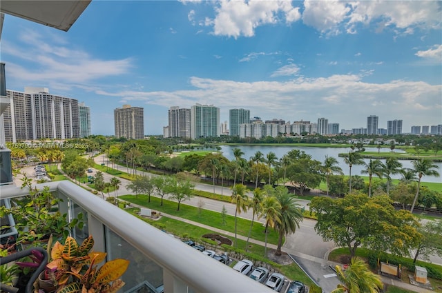 balcony with a water view and a city view