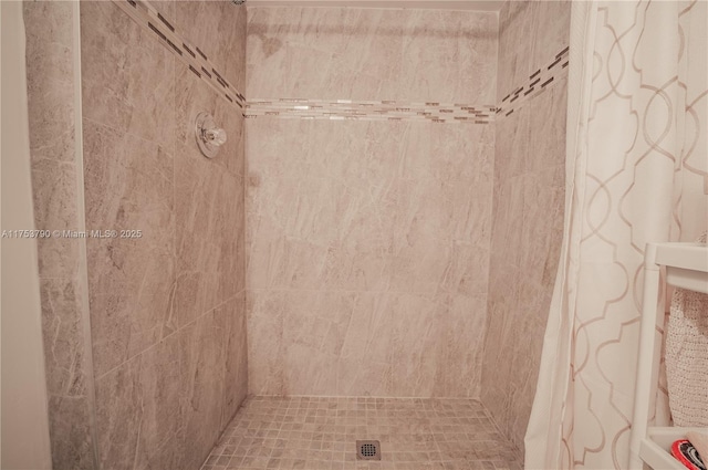 full bathroom with tiled shower