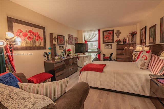 bedroom with wood finished floors