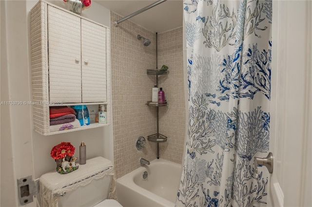 full bath featuring shower / bath combo with shower curtain and toilet