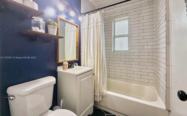 full bathroom featuring shower / tub combo, vanity, and toilet