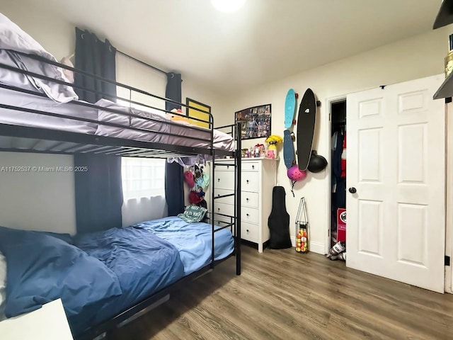 bedroom featuring wood finished floors