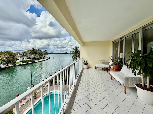 balcony featuring a water view