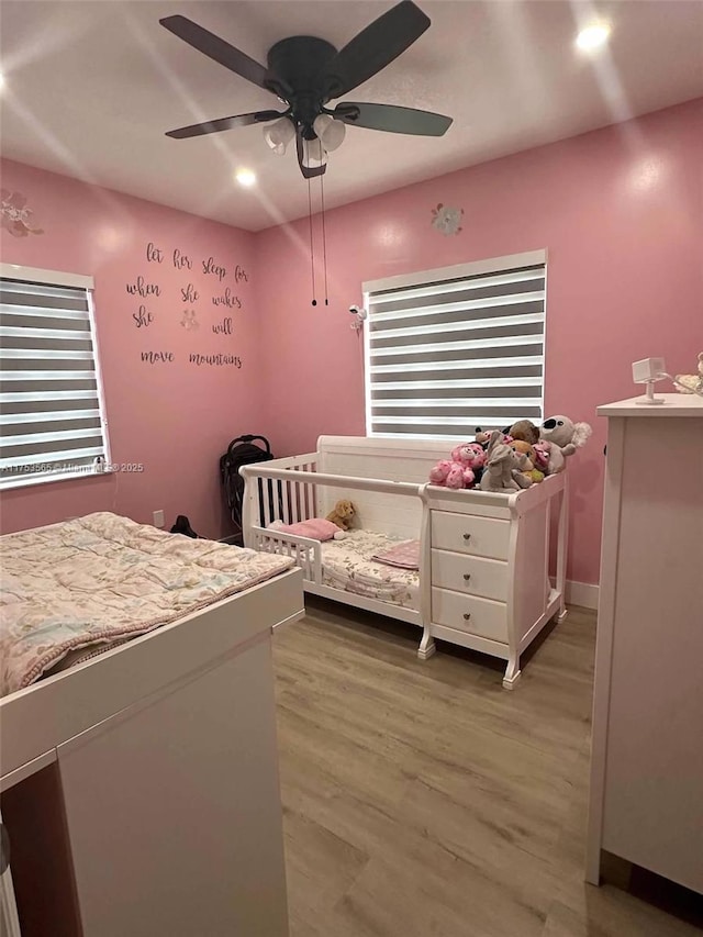 bedroom featuring light wood-style floors, recessed lighting, baseboards, and a ceiling fan