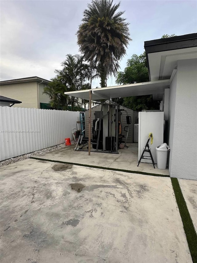 view of patio / terrace featuring fence