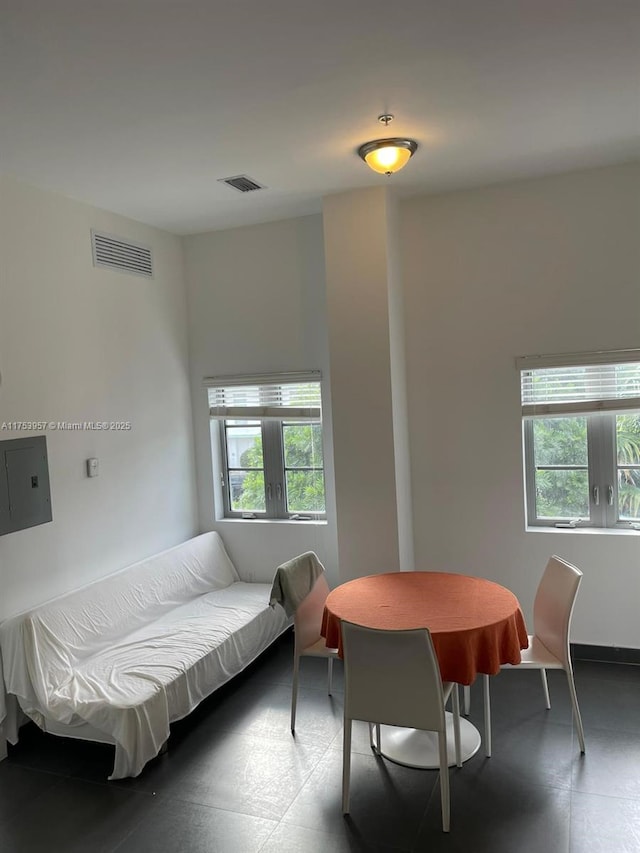 interior space featuring a healthy amount of sunlight, visible vents, and tile patterned floors