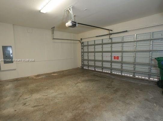 15340 SW 176th Ln, Miami, FL 33187 - garage featuring a garage door opener and electric panel