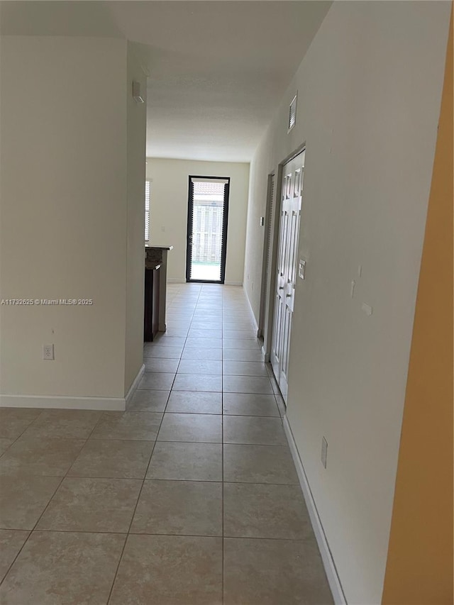 15340 SW 176th Ln, Miami, FL 33187 - hall featuring light tile patterned floors and baseboards