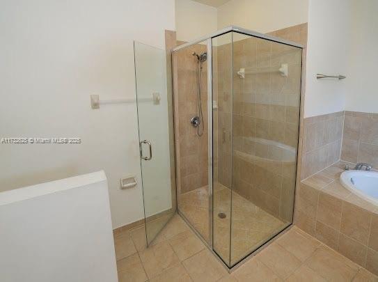 15340 SW 176th Ln, Miami, FL 33187 - full bath with a bath, a shower stall, and tile patterned flooring