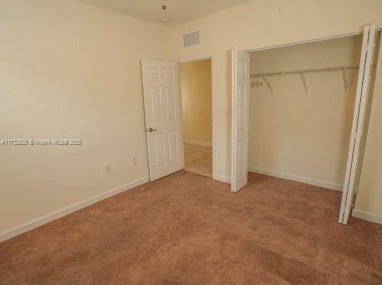 15340 SW 176th Ln, Miami, FL 33187 - unfurnished bedroom with carpet flooring and a closet