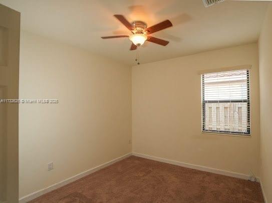 15340 SW 176th Ln, Miami, FL 33187 - carpeted spare room with ceiling fan and baseboards
