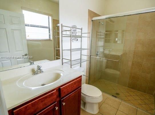 15340 SW 176th Ln, Miami, FL 33187 - full bath with a stall shower, vanity, and tile patterned flooring