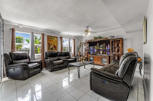 living room with light tile patterned floors, a textured ceiling, ceiling fan, and ornamental molding