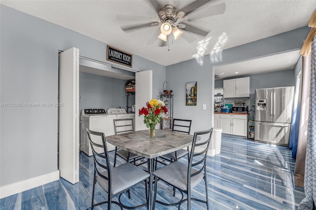 dining area with a textured ceiling, dark wood-type flooring, a ceiling fan, and washing machine and clothes dryer