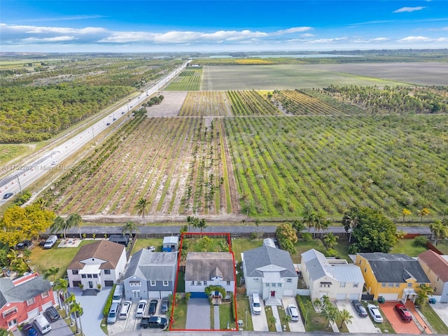 drone / aerial view with a residential view and a rural view