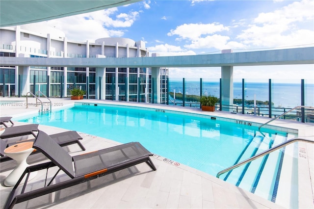 community pool with a patio area