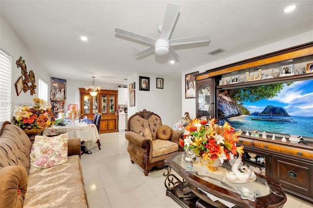 living area with ceiling fan, a textured ceiling, light tile patterned flooring, recessed lighting, and visible vents