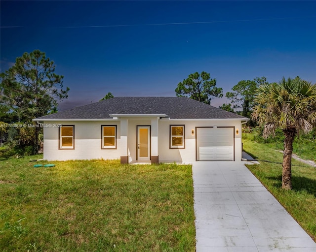 single story home with a garage, stucco siding, concrete driveway, and a yard