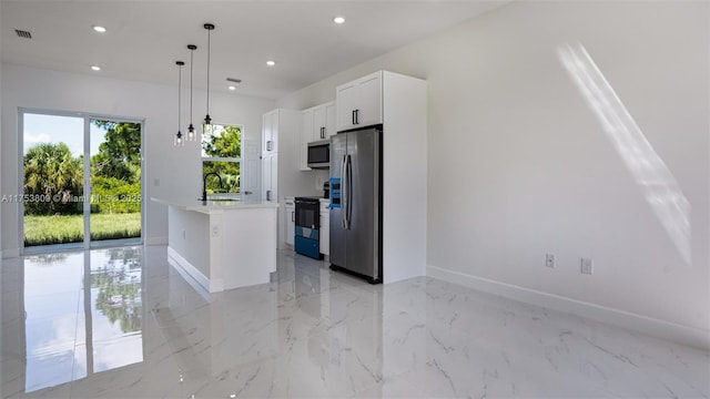 kitchen with light countertops, appliances with stainless steel finishes, visible vents, and recessed lighting