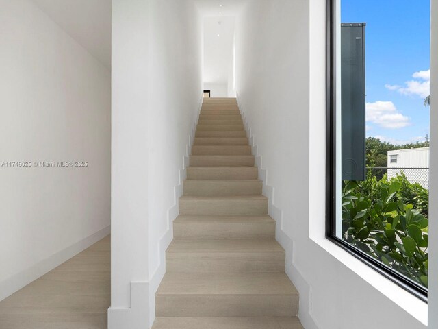 stairs with wood finished floors