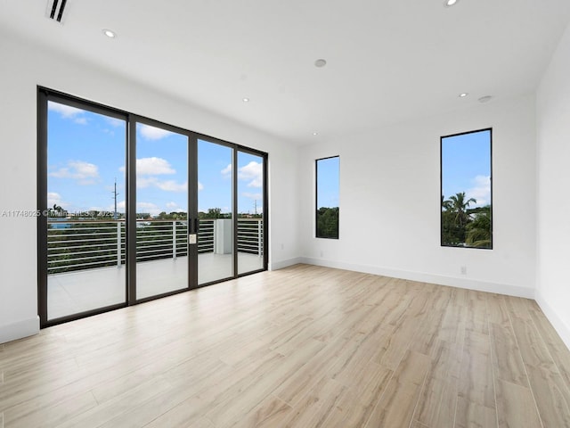 unfurnished room featuring light wood-style floors and recessed lighting