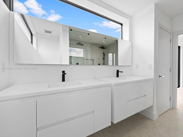 full bathroom featuring vanity and a shower stall