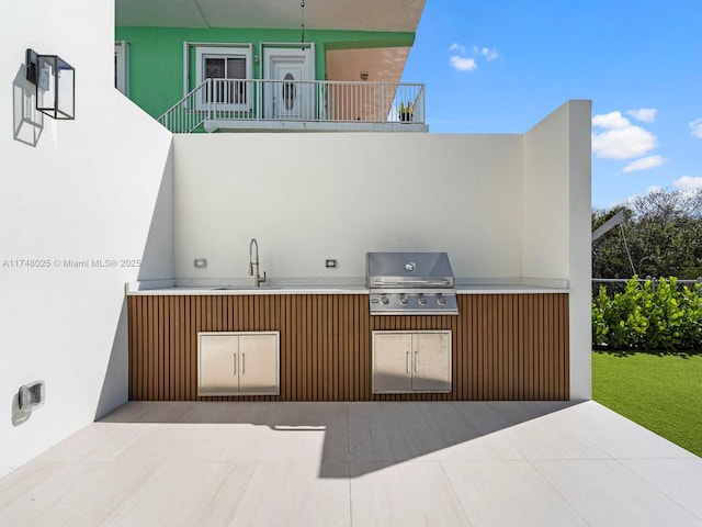 patio / terrace with exterior kitchen and a patio area