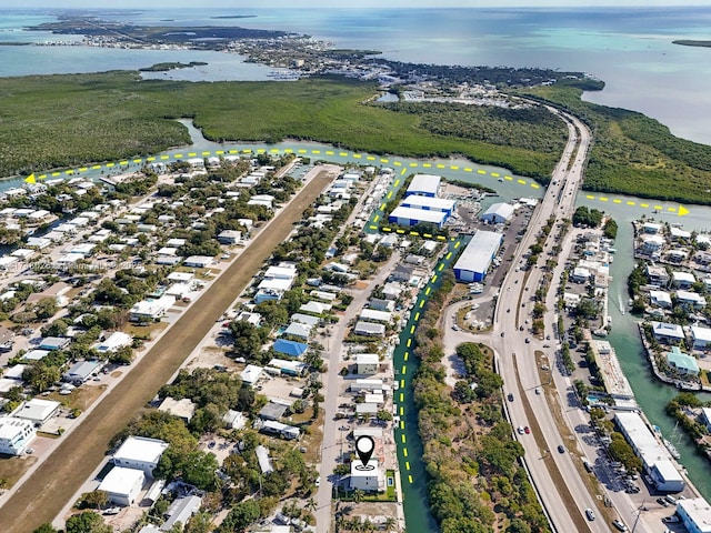 aerial view of property's location with a large body of water