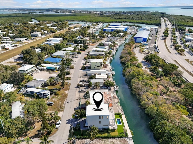 aerial perspective of suburban area with a large body of water
