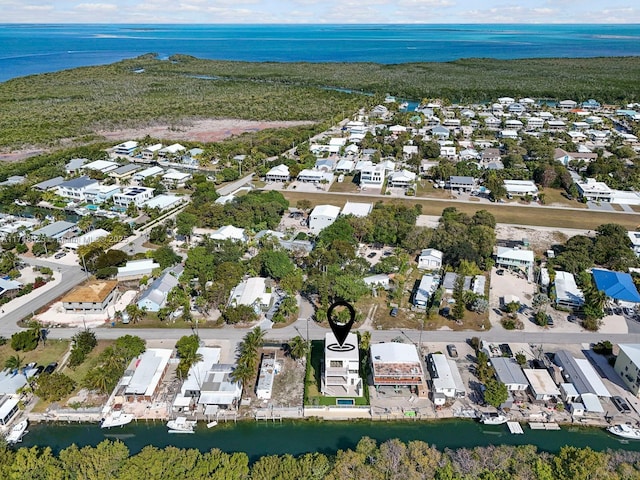 view of property location featuring nearby suburban area and a large body of water