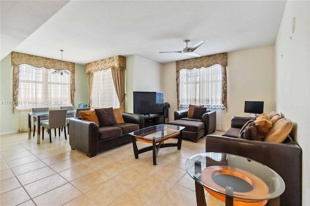 living room with light tile patterned flooring and a ceiling fan