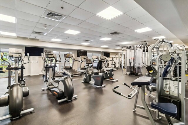 gym featuring visible vents and a drop ceiling