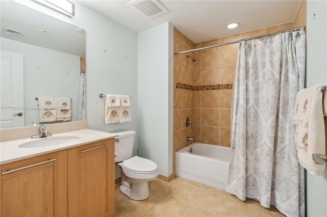 full bathroom featuring toilet, visible vents, tile patterned floors, and vanity