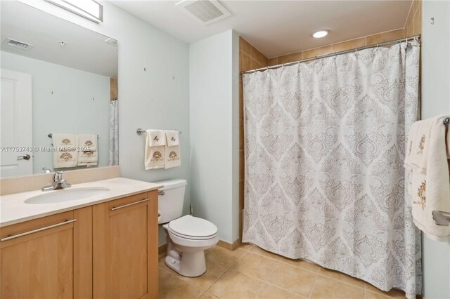 full bath with toilet, vanity, tile patterned flooring, and visible vents