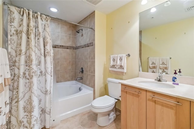 full bathroom with toilet, vanity, visible vents, and tile patterned floors