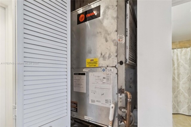 utility room with heating unit