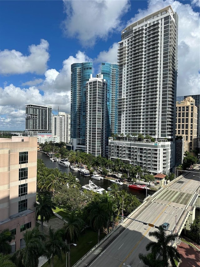 property's view of city featuring a water view