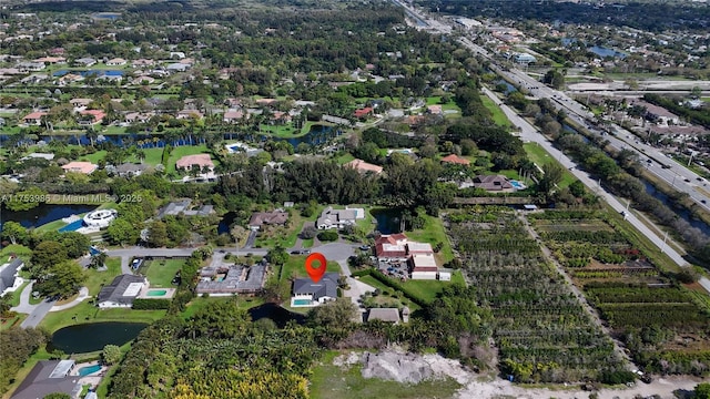 bird's eye view with a water view and a residential view